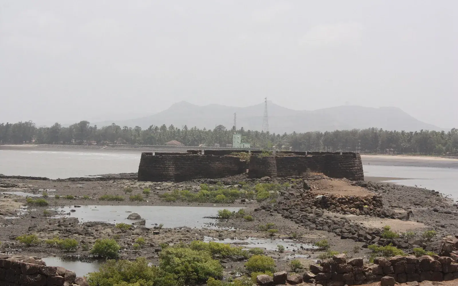 Kolaba Fort rising from the sea off Alibag beach at low tide
