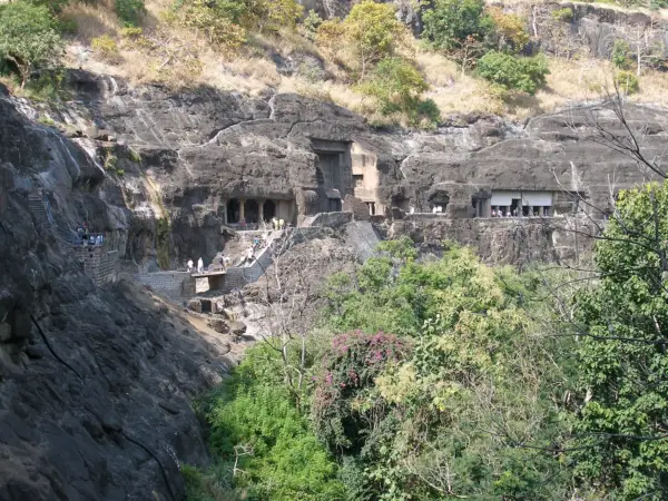 The horseshoe-shaped basalt cliff of the Ajanta Caves above the Waghur river gorge