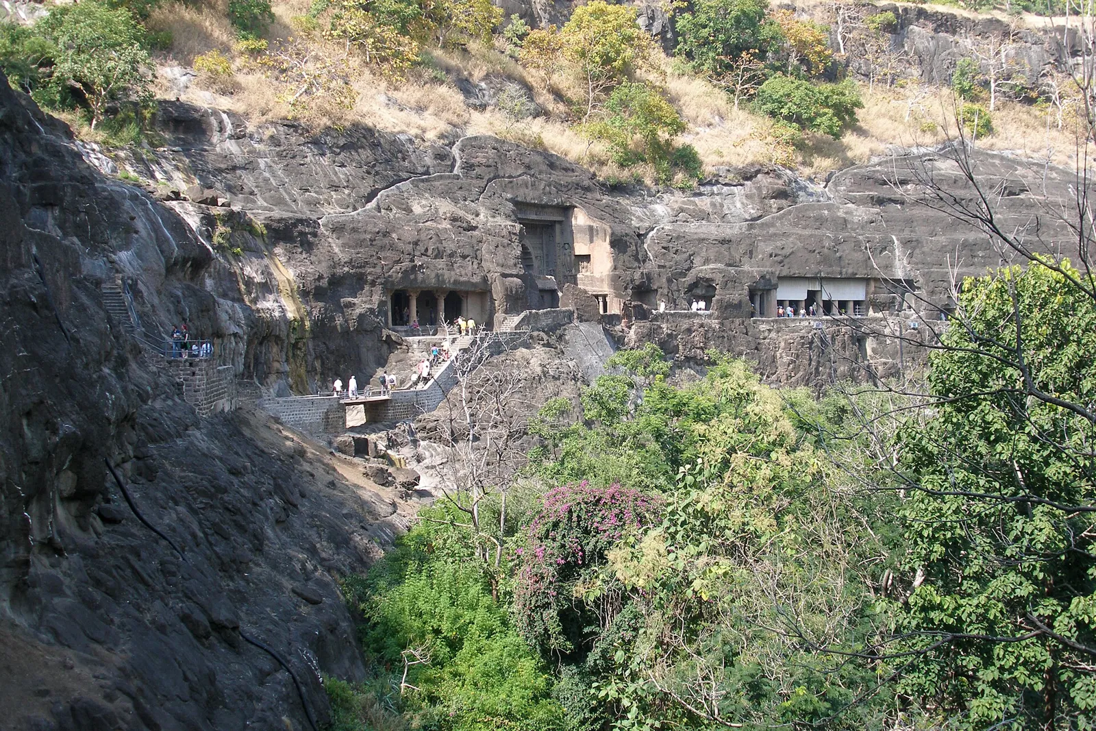 The horseshoe-shaped basalt cliff of the Ajanta Caves above the Waghur river gorge