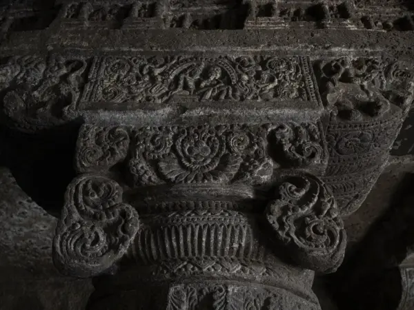 Carved pillars and relief panels inside one of the Aurangabad Caves