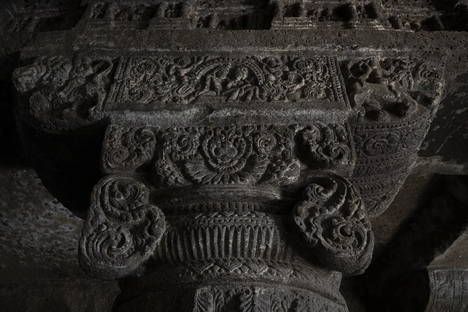 Carved pillars and relief panels inside one of the Aurangabad Caves