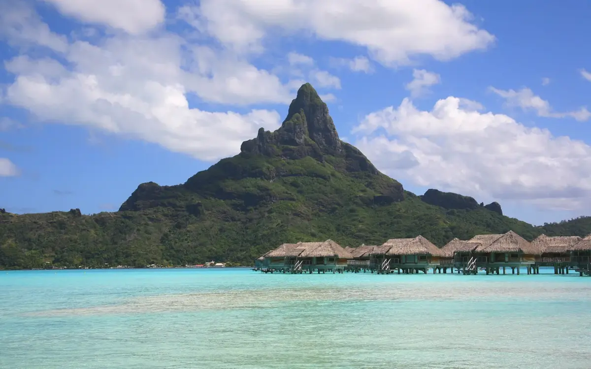 Aerial view of Bora Bora island showing its oval shape surrounded by turquoise water