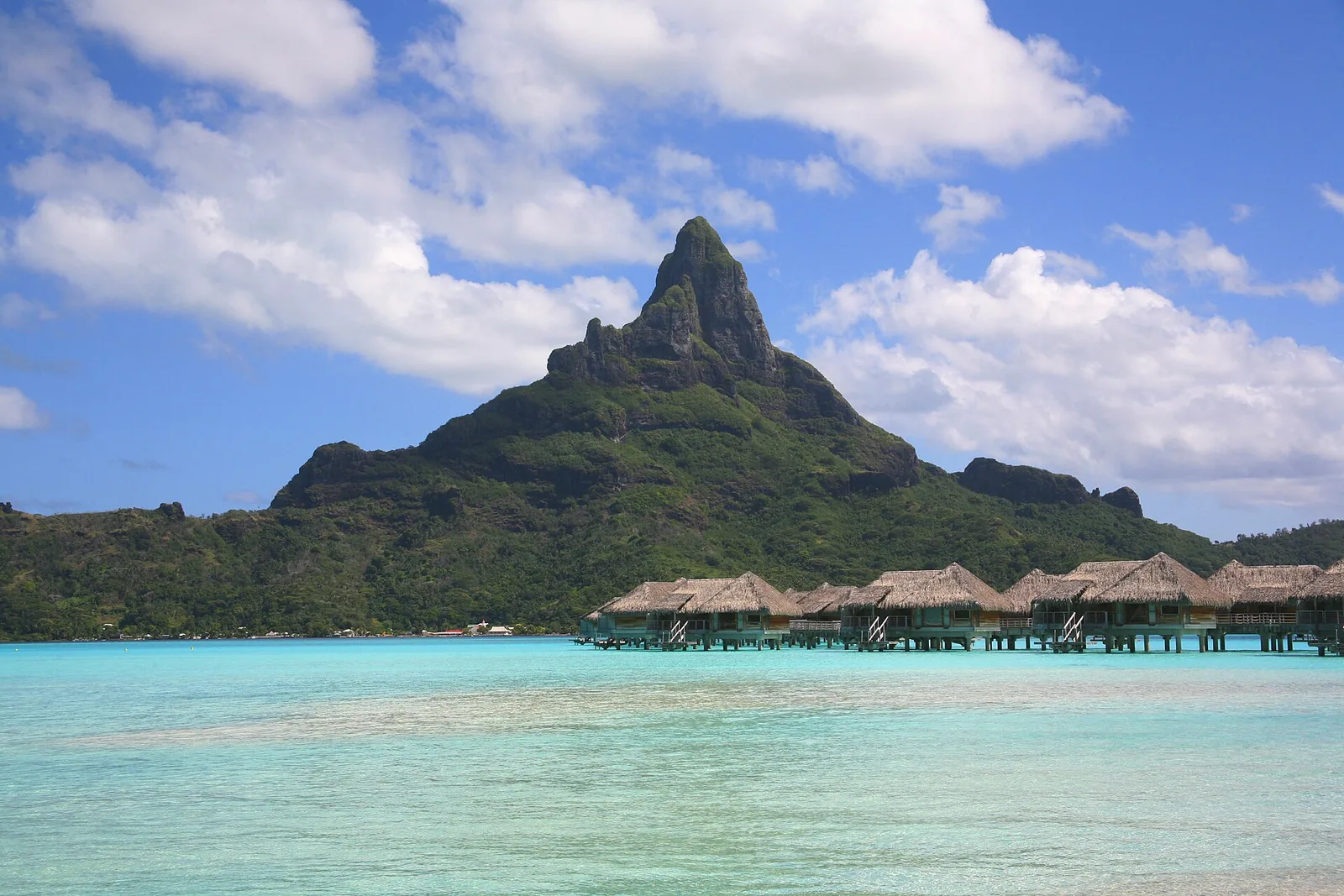 Aerial view of Bora Bora island showing its oval shape surrounded by turquoise water