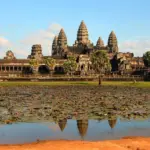 Angkor Wat and its towers reflected in the pond in front of the temple, Siem Reap