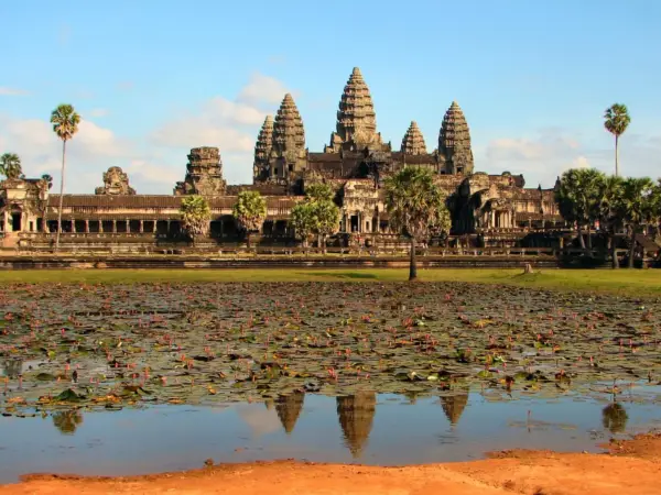 Angkor Wat and its towers reflected in the pond in front of the temple, Siem Reap