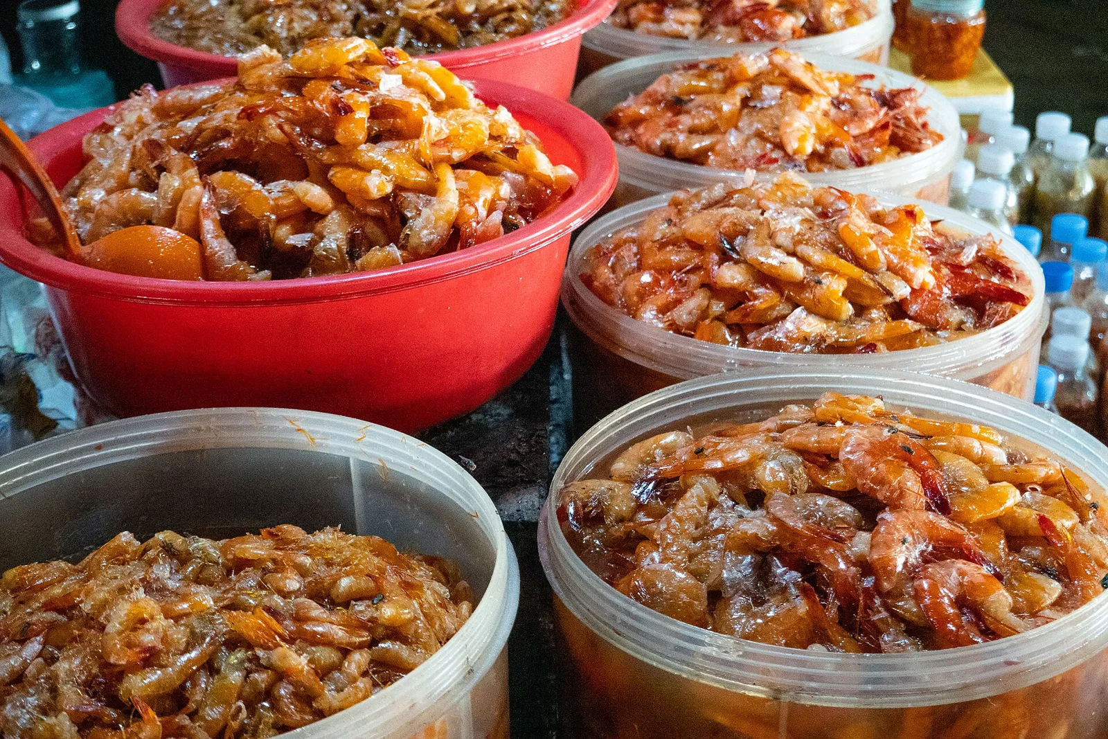 Tubs of dried seafood for sale at the crab market in Kep, Cambodia