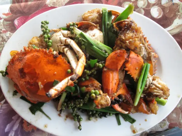 A plate of Kampot pepper crab stir-fried with green peppercorns and spring onion