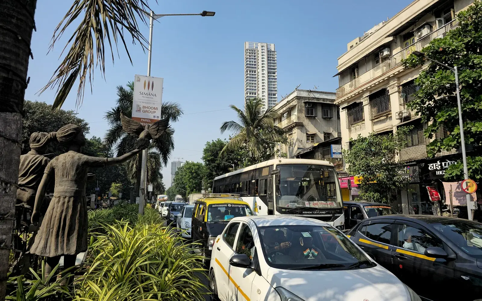 Panoramic view of Mumbai’s dense urban sprawl with sea in the background