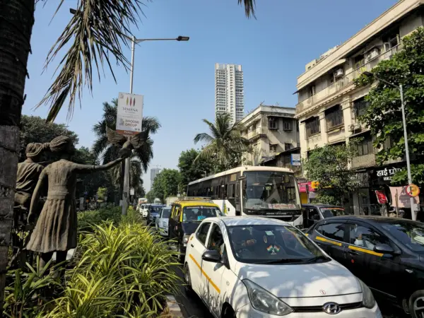 Panoramic view of Mumbai’s dense urban sprawl with sea in the background