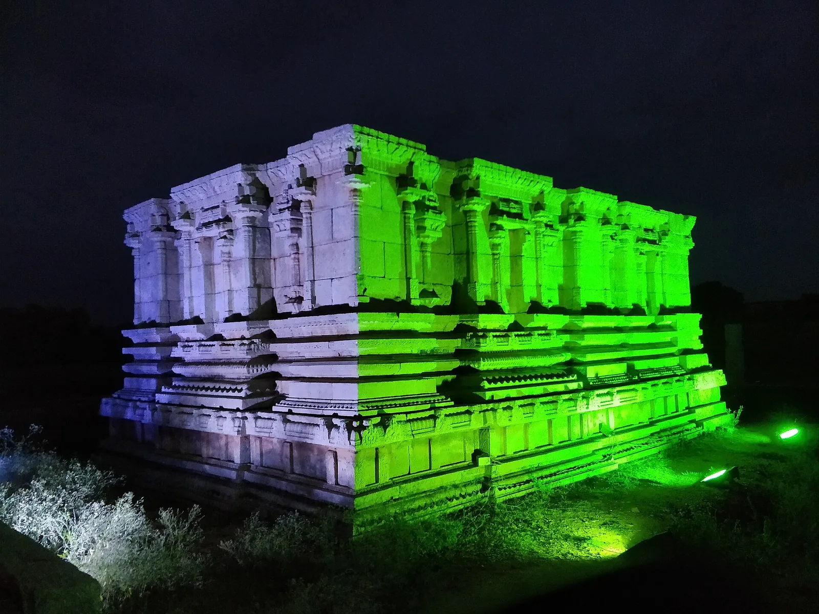 A Hampi temple lit up in colour at night