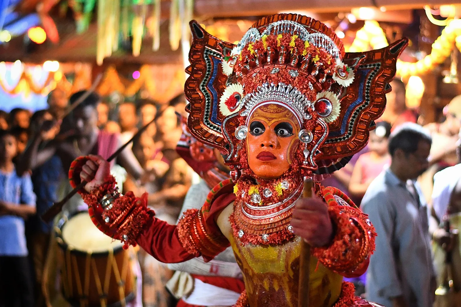 Theyyam performers in traditional attire perform at Muzhappilangad village, Kerala.