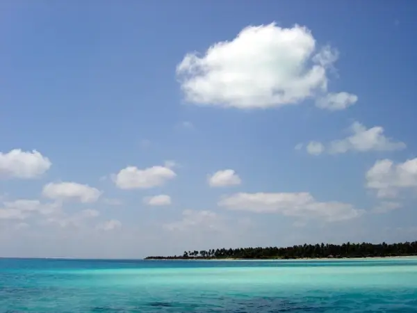 Turquoise sea and a low, palm-covered island off Bangaram