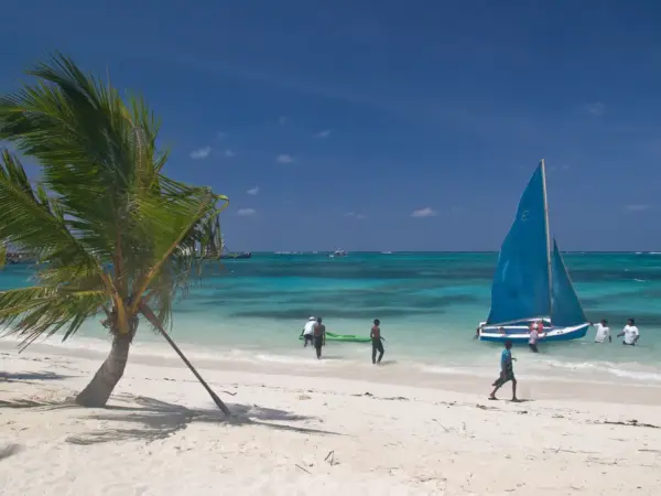 A small sailboat on the shallow turquoise lagoon at Kavaratti