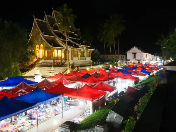 Stalls of the Luang Prabang night market lit up after dark
