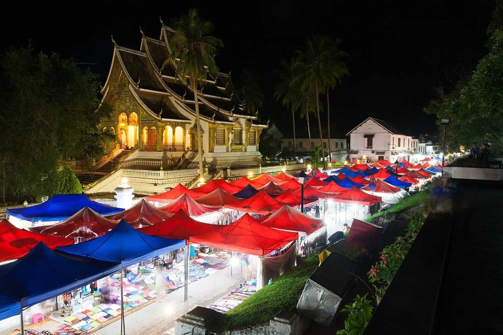 Stalls of the Luang Prabang night market lit up after dark