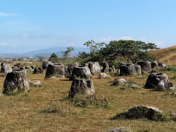Ancient stone jars on the grassland at the Plain of Jars, Xieng Khouang
