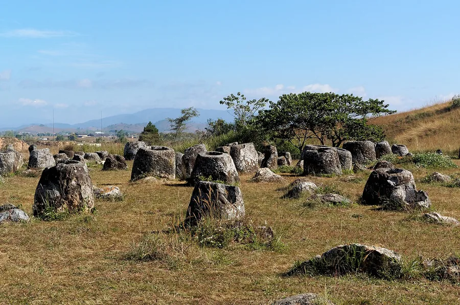 Ancient stone jars on the grassland at the Plain of Jars, Xieng Khouang