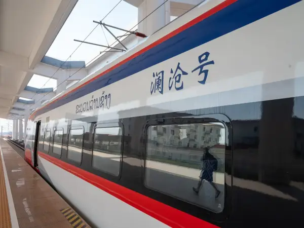 A Laos–China Railway train at a station in Laos