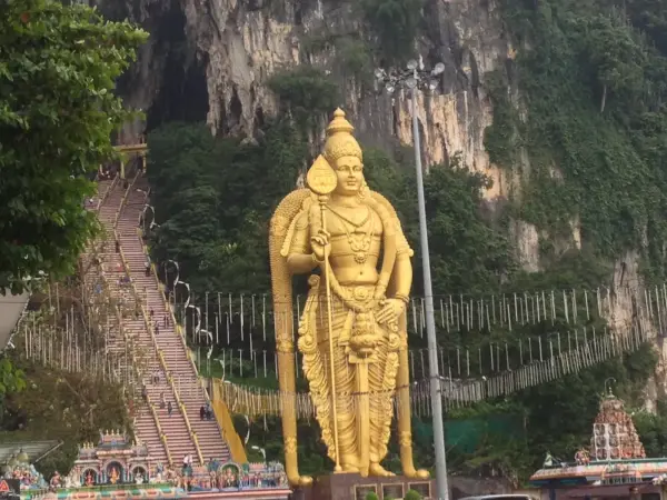 The giant golden Murugan statue and the stairway at Batu Caves, near Kuala Lumpur