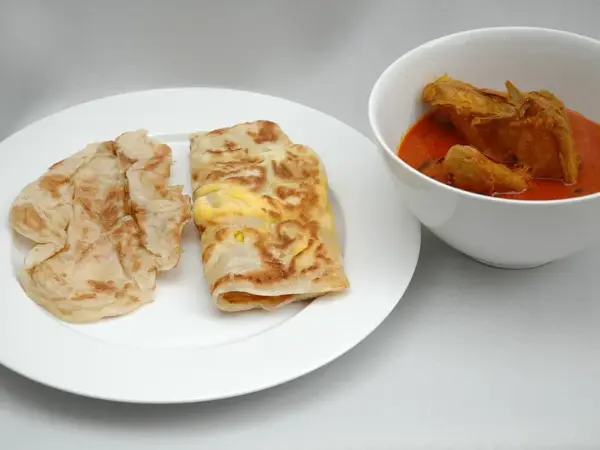 Roti canai, flaky flatbread served with curry