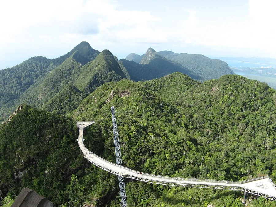 The Langkawi Sky Bridge curving over the forested peaks of Gunung Mat Cincang