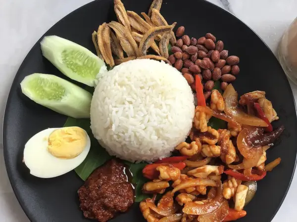 Nasi lemak with sambal, egg, peanuts and anchovies
