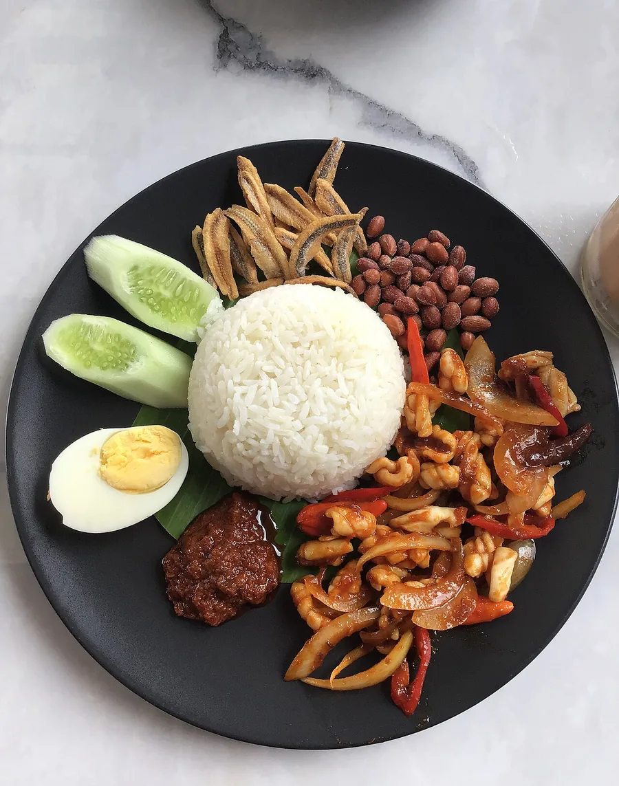Nasi lemak with sambal, egg, peanuts and anchovies