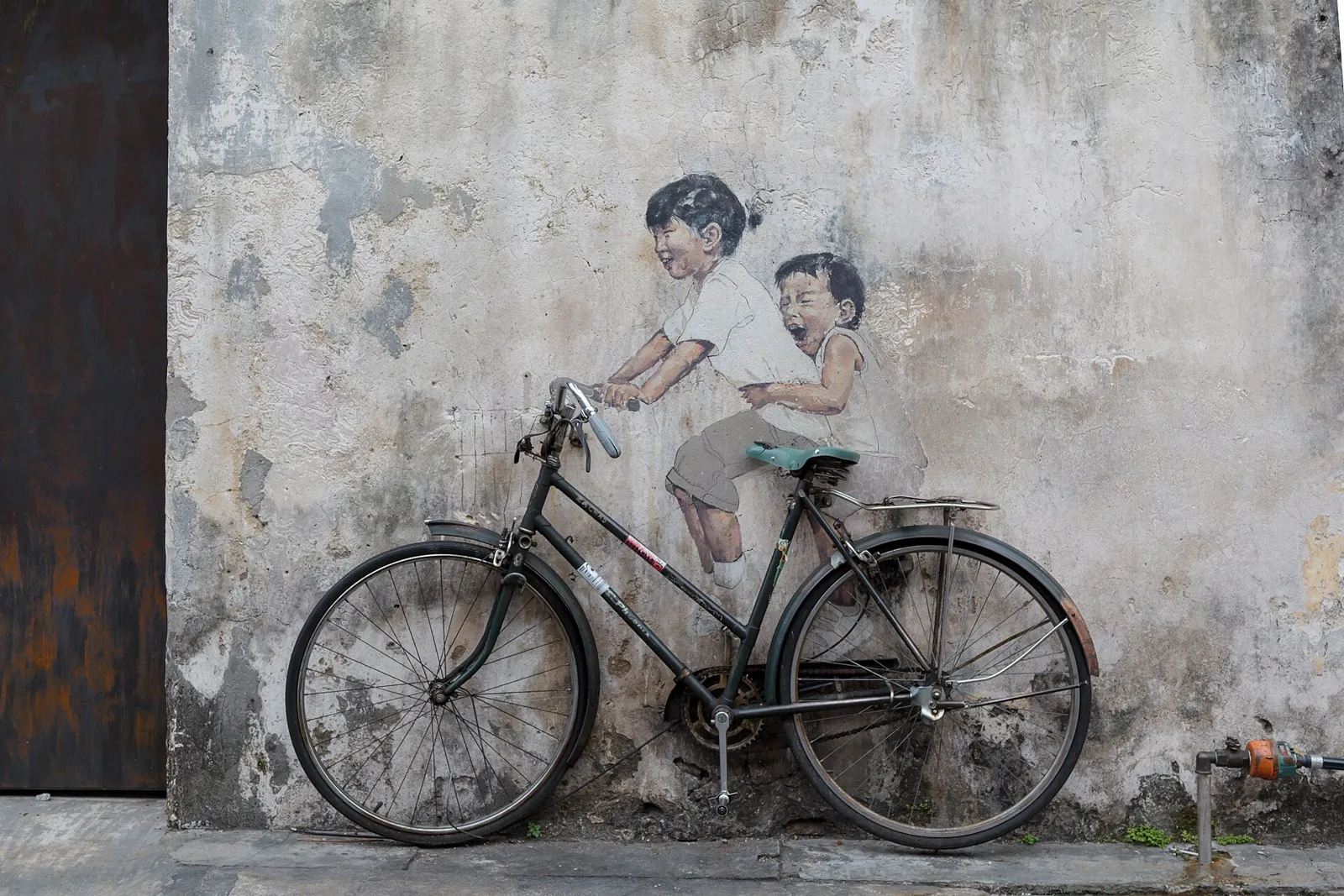 A street-art mural on a shophouse wall in George Town, Penang