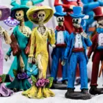 Colorful Catrina skeletons with floral hats, typical of Day of the Dead celebrations in Mexico