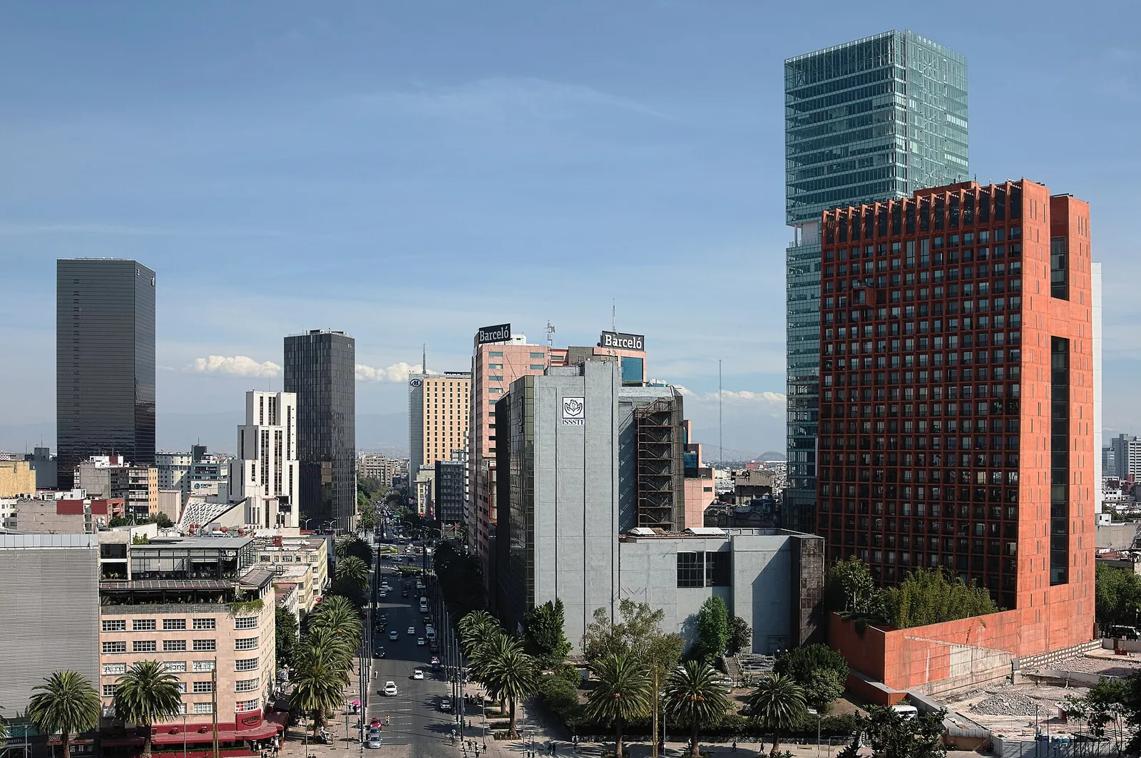 Wide view down Republic Avenue framed by the Revolution Monument in Mexico City