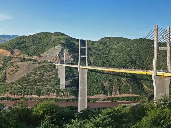Long steel Mezcala Bridge spanning a river on Highway 95D, seen from a distance
