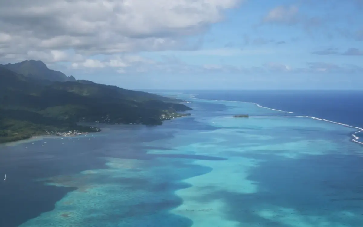 Aerial view over Raiatea’s green slopes and lagoon