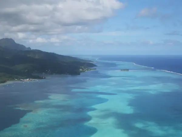 Aerial view over Raiatea’s green slopes and lagoon