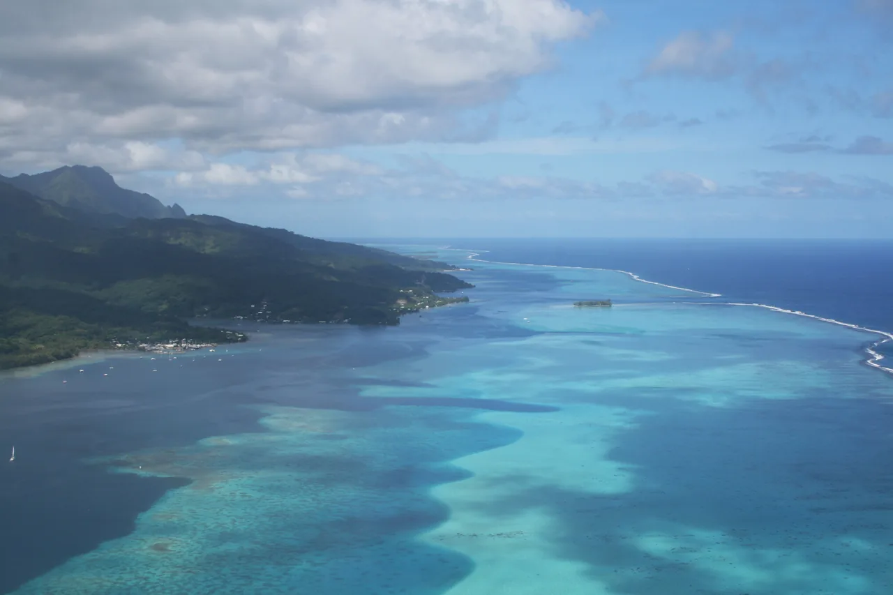 Aerial view over Raiatea’s green slopes and lagoon