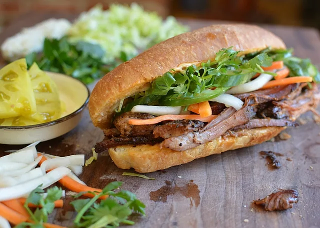 Bánh mì filled with pork, pickled vegetables and herbs